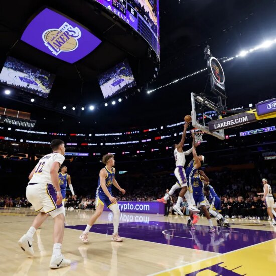 The Los Angeles Lakers face off against the Golden State Warriors in the first half at Crypto.com Arena on Oct. 12, 2025.