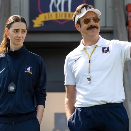Ted Lasso and Rebecca meet on the tarmac in front of a plane