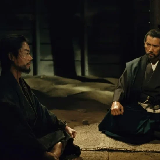 Prisoner Kanbei (Masaki Suda) sits with Lord Murashige (Masahiro Motoki) in The Samurai and the Prisoner.
