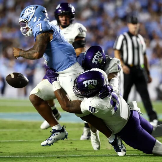 Jonathan Bax #10 of the TCU Horned Frogs sacks Gio Lopez #7 of the North Carolina Tar Heels and causes a fumble during the second half of the game at Kenan Stadium on Sept. 1, 2025 in Chapel Hill, North Carolina.