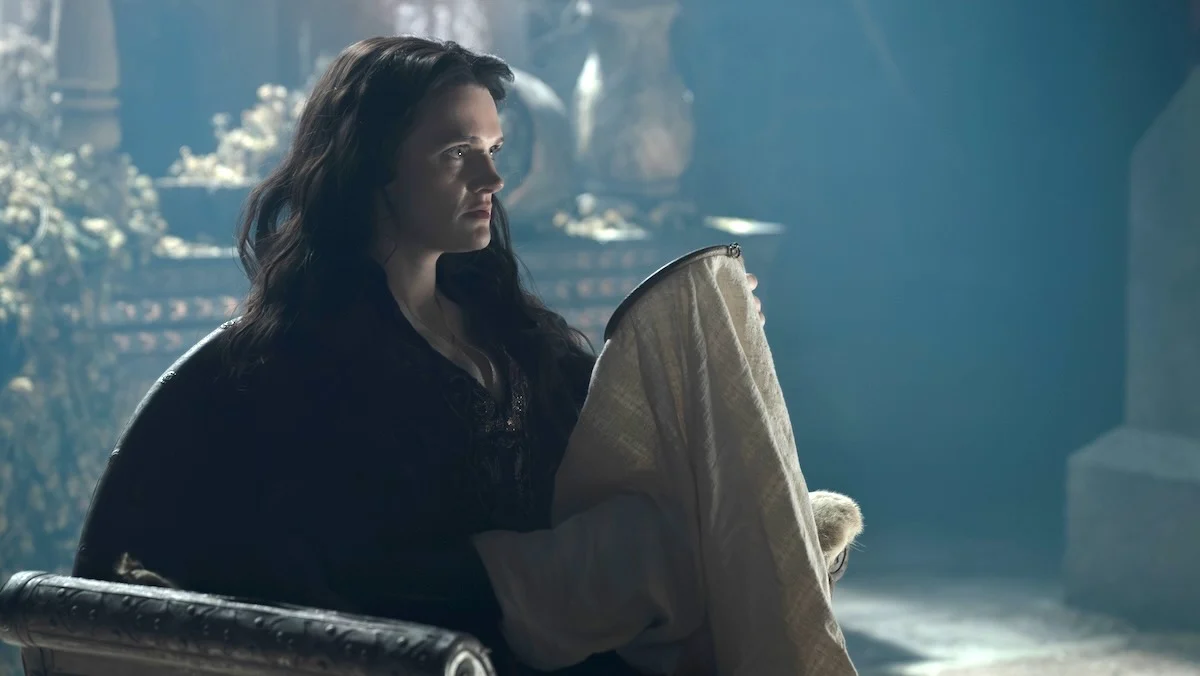 Gayle Rankin as Alys River near a fireplace on House of the Dragon