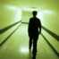 Paul Syre walks down a terrifying hallway in the found-footage horror movie Infirmary.