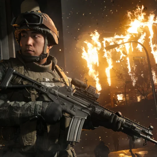 A soldier in tactical gear holding a rifle in front of a burning building in Call of Duty: Modern Warfare 4.